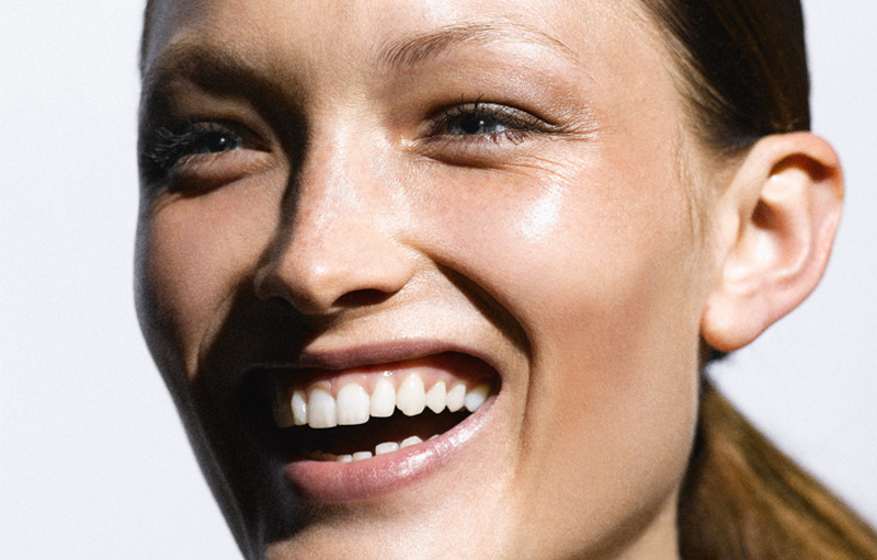 A young woman wearing a fresh and glowy makeup, by Louise Wittlich